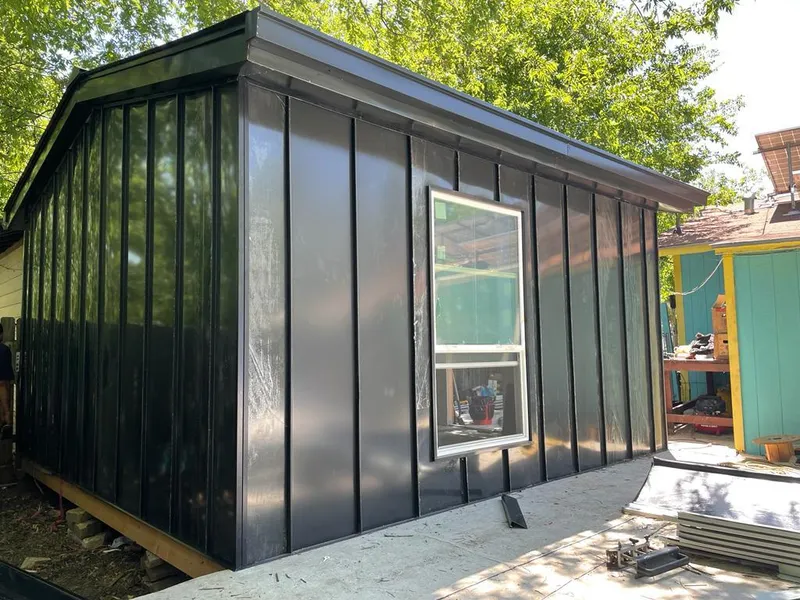 Black standing seam metal wall panels for Roof Inspection in Detroit